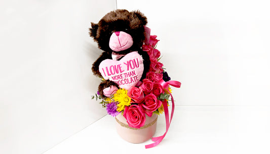 I love you more teddy bear in pink vase