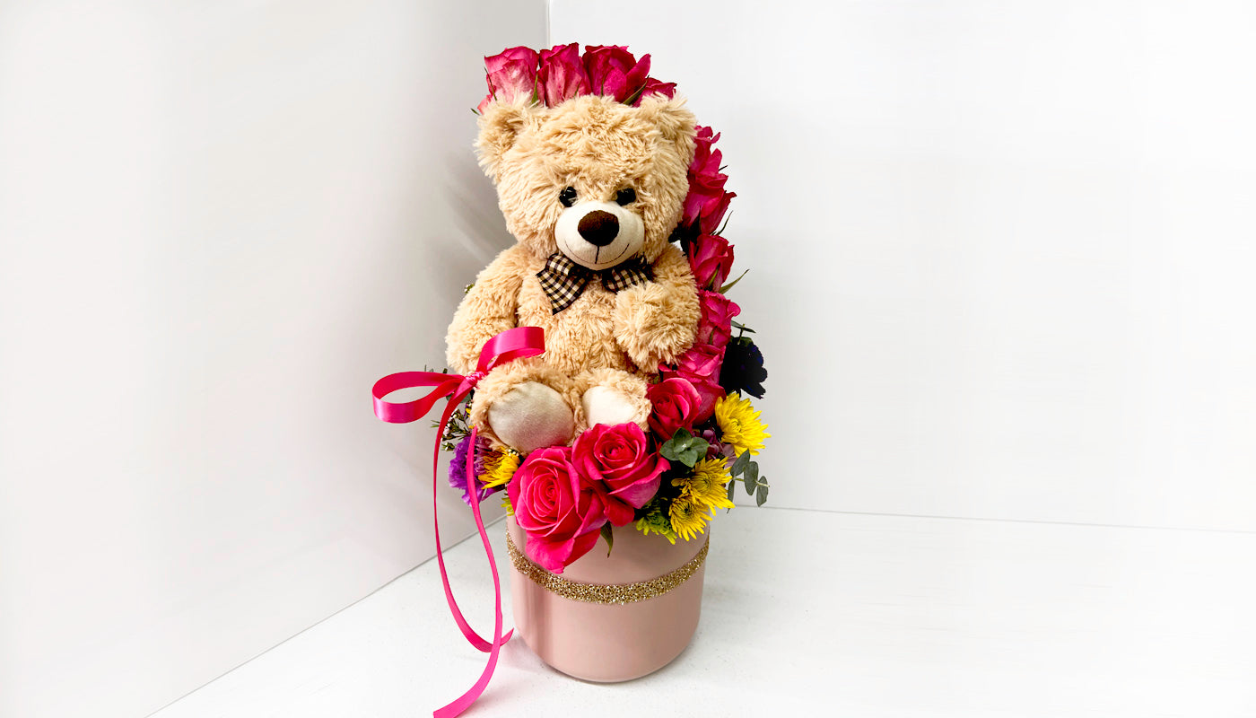 Teddy bear in pink vase