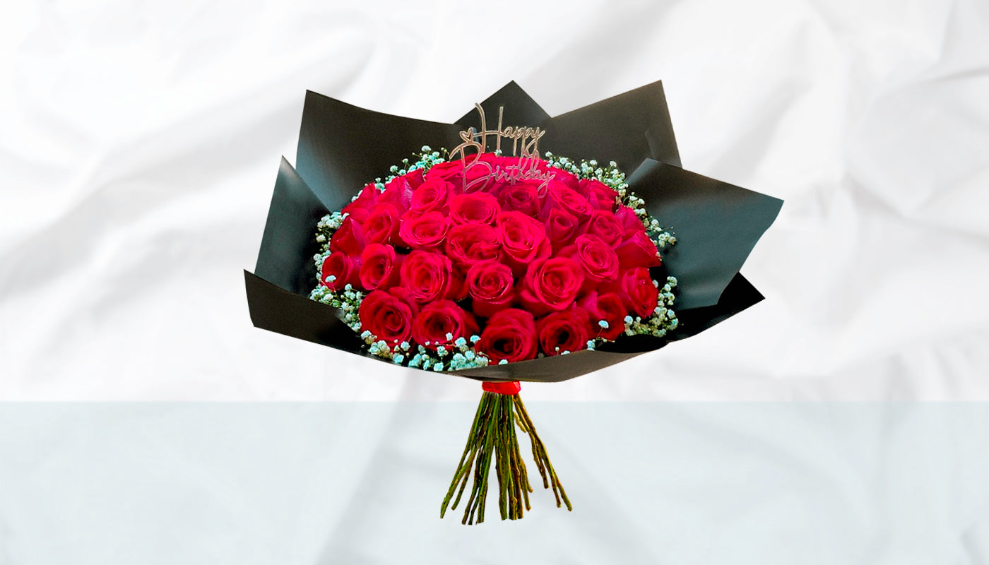 Red roses with fillers and occasion topper