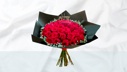 Red roses with fillers and occasion topper