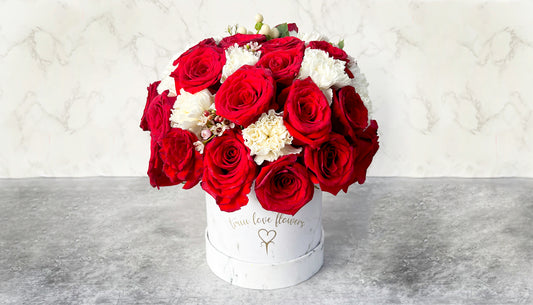 Mix of flowers in marble box