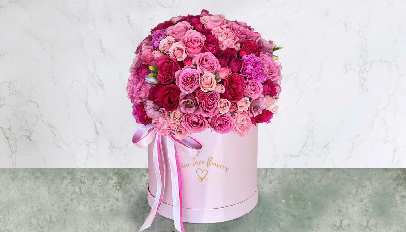 Lovely box with ribbon and mix of roses