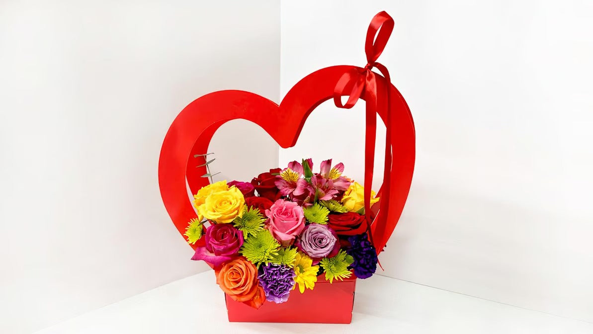 Red heart box with mix of flowers