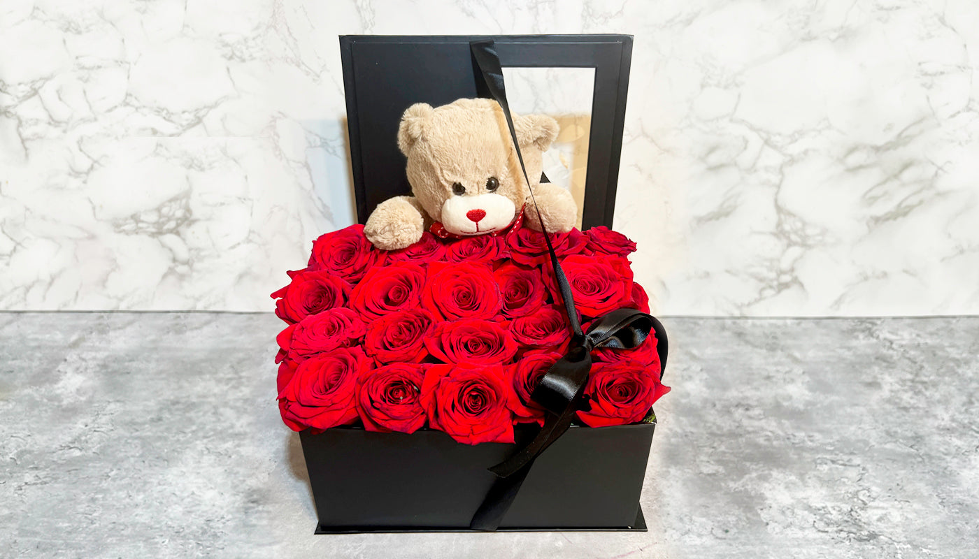 Beautiful box of flowers and bear